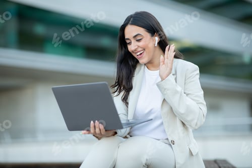 Preview: Woman Using Laptop for Video Call During the Day