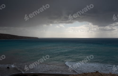 Preview: Stormy sky with dramatic clouds and sea. Stormy weather at the ocean