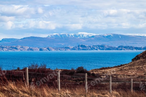 Preview: Fenced outdoor area with a scenic backdrop of mountains and a lake in Isle of Skye, Scotland, UK