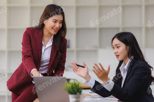 Preview: Businesswomen collaborating on project, discussing work at office