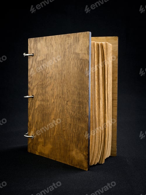 Preview: Wooden notebook on a dark background.