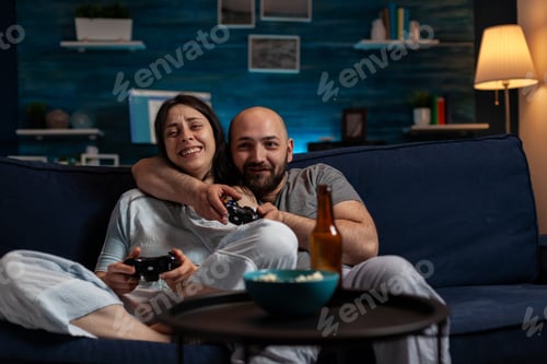 Preview: Happy girlfriend and boyfriend enjoying videogames play