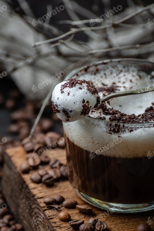 Preview: Milk foam with chocolate chips on a cup of cappuccino.