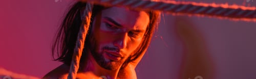 Preview: Long haired model posing with ropes on purple background with light, banner