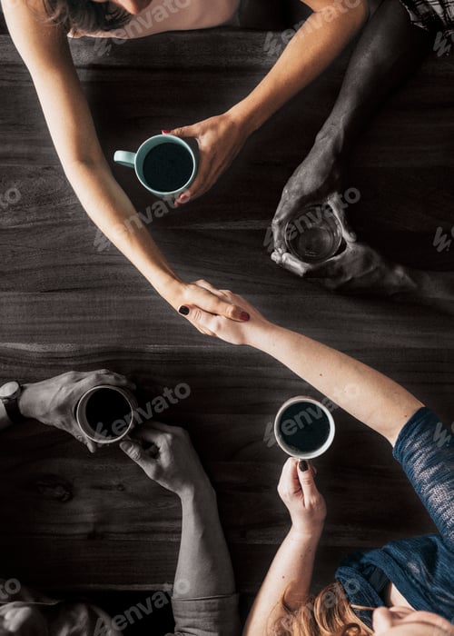 Preview: People shaking hands over coffee