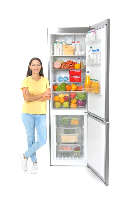 Preview: Young woman near open refrigerator on white background