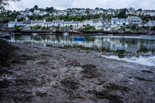 Preview: A small sheltered harbour and mooring for boats. Houses on the hillside overlooking the bay, and