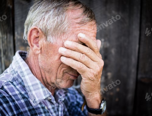Preview: Desperate Senior Man Suffering And Covering Face With Hands In Deep Depression, Pain, Emotional