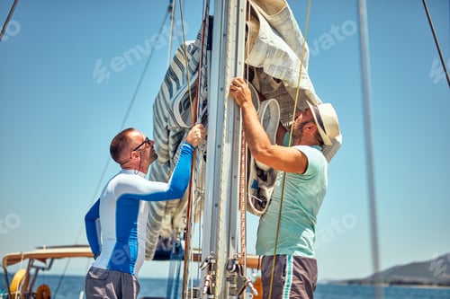 Preview: Sailor Packing / Unpacking Main Sail Wing On The Boat.