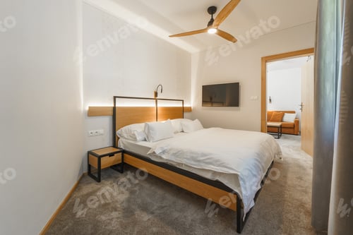 Preview: Interior of modern bedroom suite in luxury hotel
