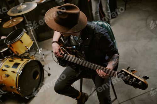 Preview: Musician Plays Bass Guitar with Yellow Drum Set