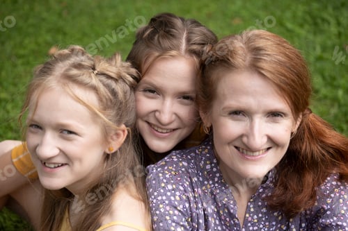 Preview: smiling mom and daughters