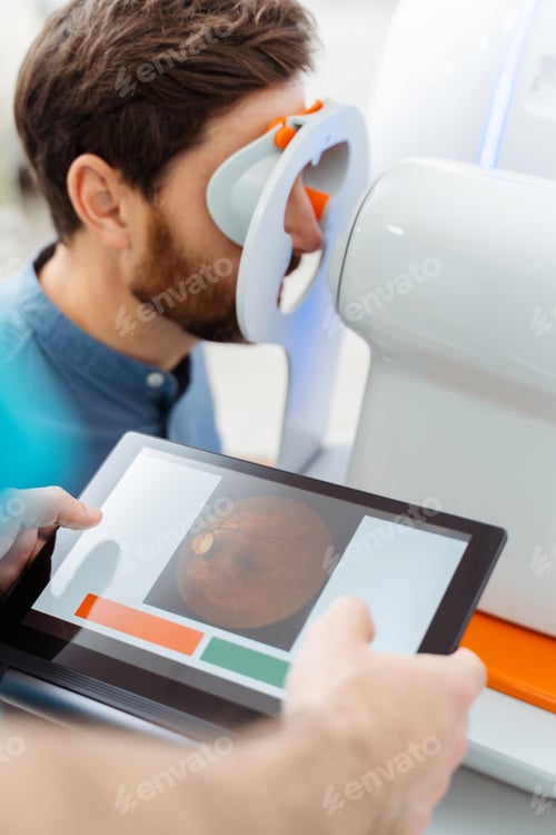 Preview: Young man visiting ophthalmologist in modern clinic