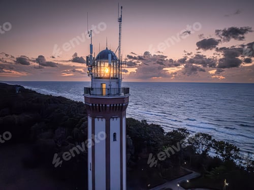 Preview: Light beam from lighthouse by Baltic Sea at dusk