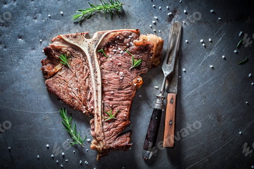 Preview: Well done tbone steak. Tbone steak with herbs and salt.