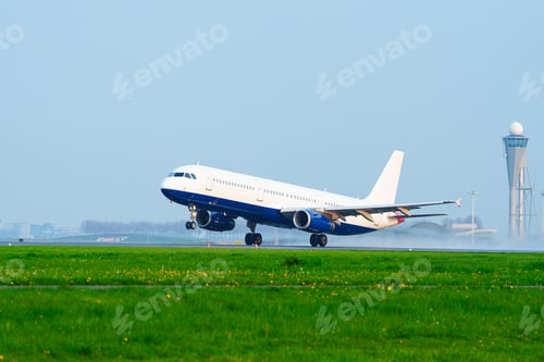 Preview: Passenger Plane Taking Off on Runway in Rainy Condition: Travel Destination Weather