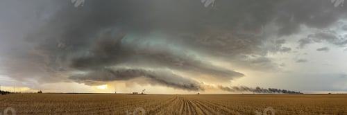 Preview: The skies full of clouds, above cornfields, a Severe-Warned Supercell storm.