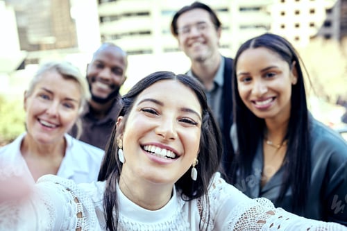 Preview: Shot of a group of business colleagues taking selfies outside