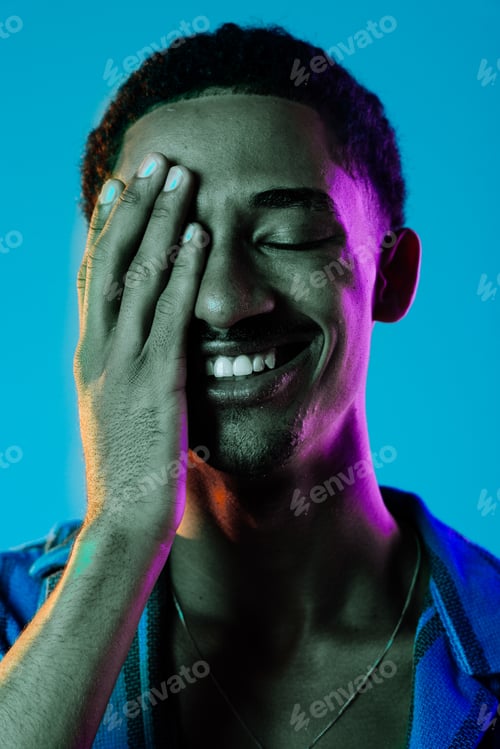 Preview: African man portrait in studio on colorful background