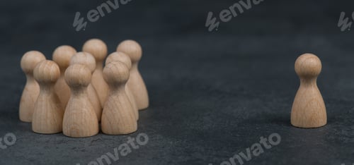 Preview: Group of people standing together, one leader standing alone on the opposite side