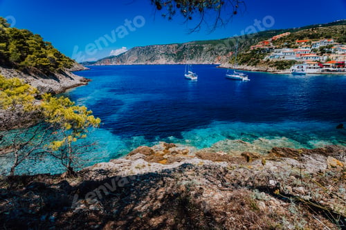 Preview: Amazing Greece, white sail boats in blue bay of picturesque colorful village Assos in Kefalonia