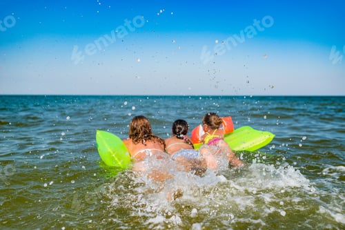 Preview: Rear view of a positive young family mom