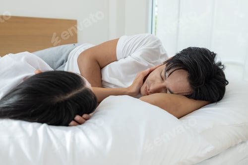 Preview: Happy Couple Relaxing Together in Bed