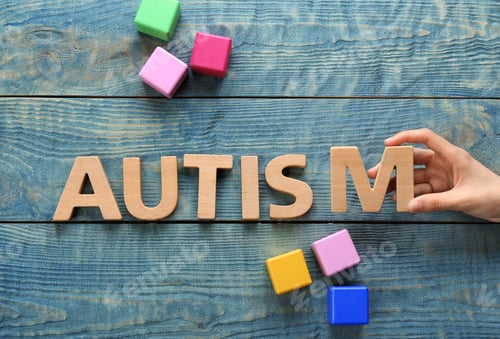 Preview: Woman and word AUTISM made with letters on wooden background