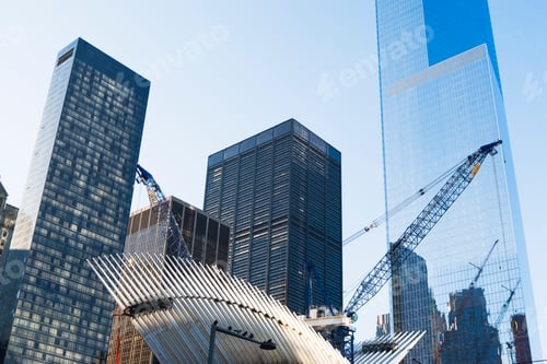 Preview: Skyscrapers tower over the sculptural architecture of a transit hub.