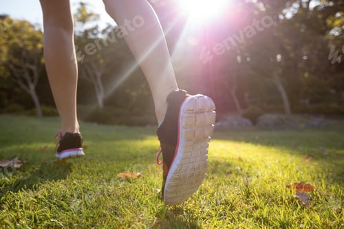 Preview: Feet of jogger jogging in the park