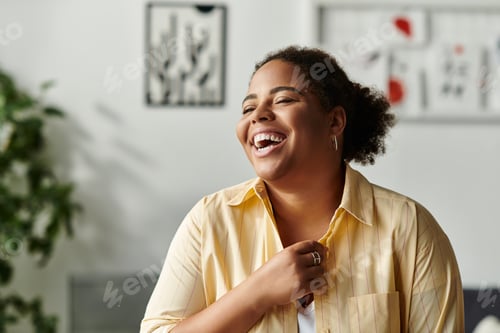 Preview: Joyful moments of an african american woman relaxing in her modern apartment