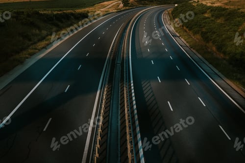 Preview: Sunset and mountains over a highway surrounded by nature