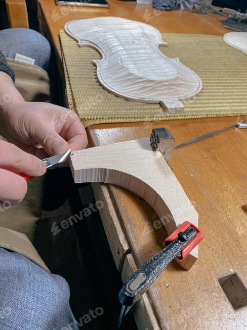 Preview: violin maker artisan cutting fillet purfling with tool to join other side of edge in inlaid channel