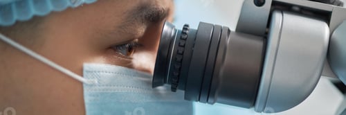 Preview: Young Adult Asian Male Surgeon Using Microscope during Medical Operation