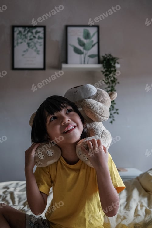 Preview: Kid playing alone with her teddy bear
