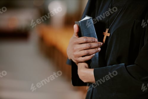 Preview: Unrecognizable Black Nun With Book In Hands