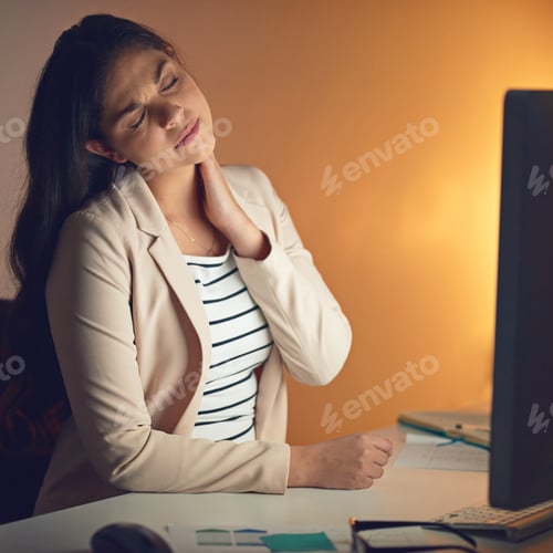 Preview: Shot of a young businesswoman experiencing strain during a late night at work