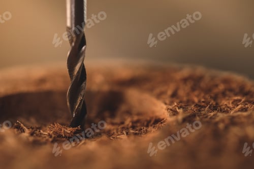Preview: Close-up of drill bit in the piece of wood