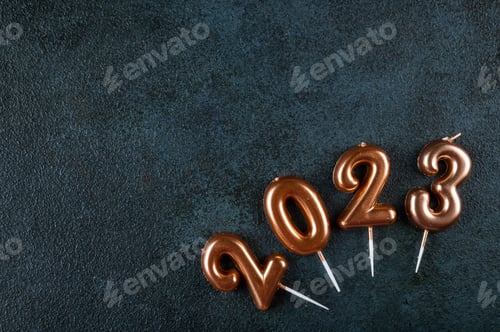 Preview: Holiday background Happy New Year. Numbers 2023 made by gold candles.