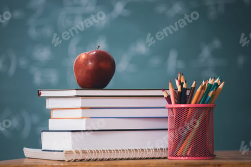 Preview: Pencils and book and blackboard. Education concept.