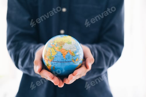 Preview: Man holding globe on her hands
