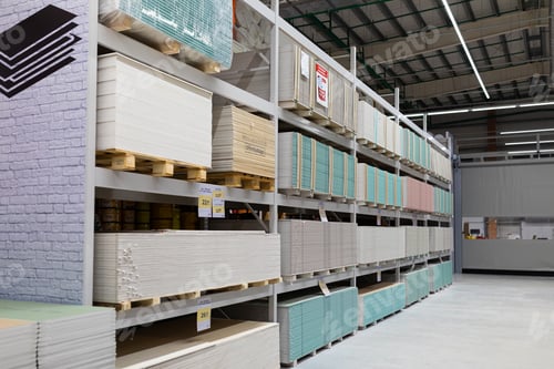 Preview: MINSK, BELARUS - April 01, 2020: hardware store with counters of gypsum fiber sheet from different