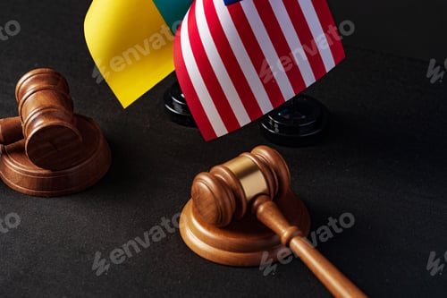 Preview: Two judge's gavels with USA flag and flag of Ukraine on black background