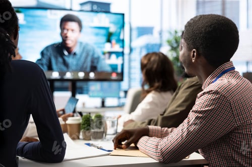 Preview: General manager checking on his staff via remote videocall connection
