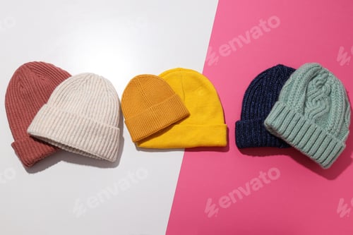 Preview: Multicolored warm hats on a light background