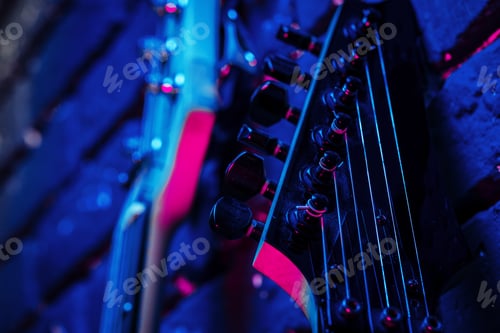 Preview: Guitar headstock with tuners on dark background