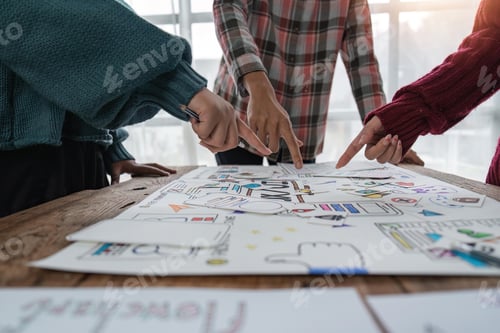 Preview: UX developer and ui designer brainstorming about mobile app interface wireframe design at modern