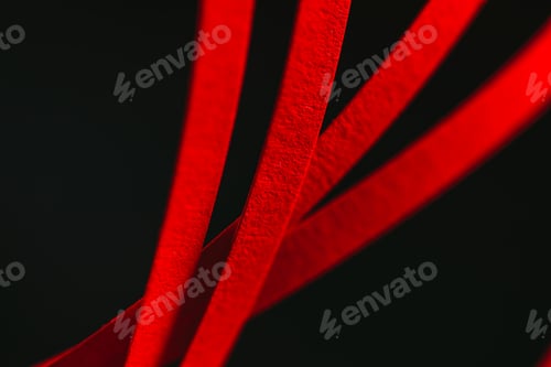 Preview: close up view of red quilling striped paper on black