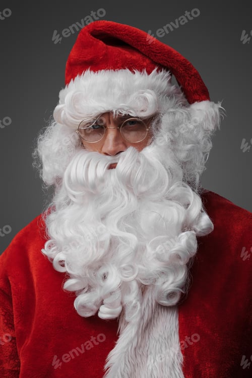 Preview: Santa dressed in red suit and hat isolated on grey