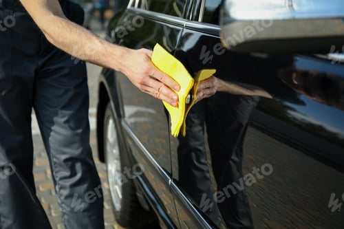 Preview: A man rubs a car. Car wash. Clear car concept